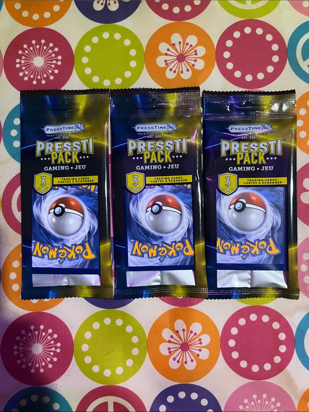 Pokemon Pressti Pack Booster Packs - Blue, Purple, Yellow